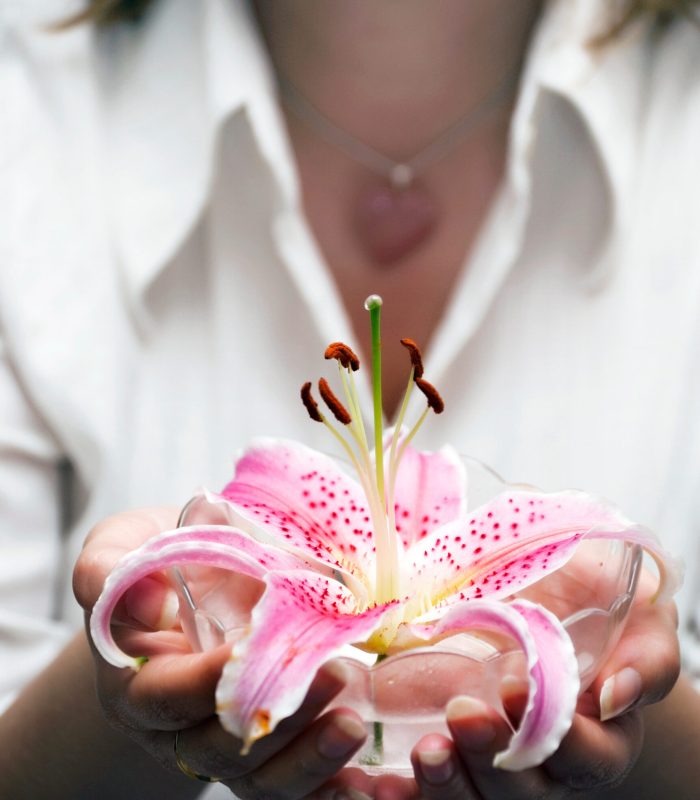 Woman holding an orchid